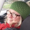 Elizabeth Fisher sat in car wearing green hat
