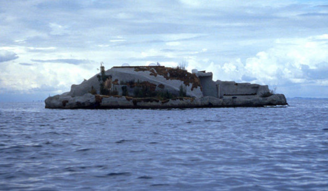 1998-1999, floating concrete island anchored off the coast of Denmark, on which the artist lived for one month, 44 tons, 23 × 54 feet.